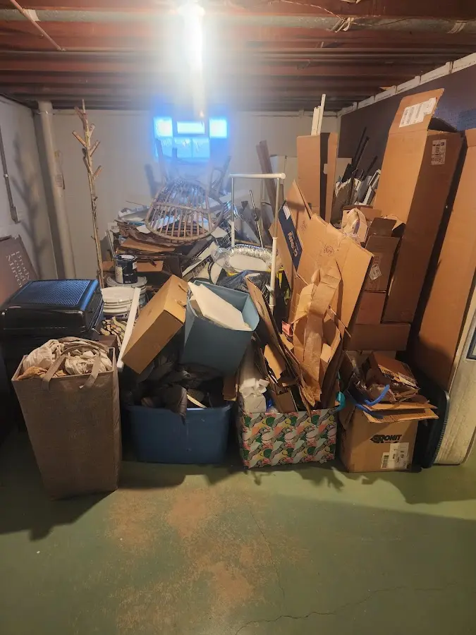 Roll-off dumpster container at job site for 2 Yard Dumpster Rental in Hampstead